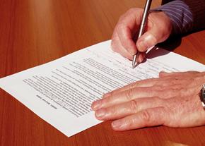 Man Signing a Form